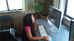Girl working on computer.